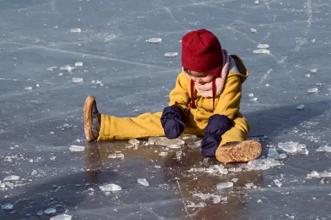 an image of a kid playing on ice