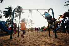 an image of kids playing at the playground