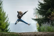 an image of a kid jumping in air