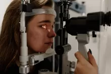 an image of of an female having eye exam