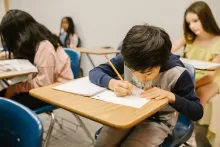 a photo of a kid doing homework