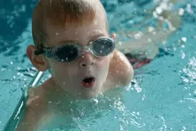 a boy swimming 