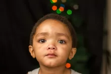 a kid with tears in the eyes